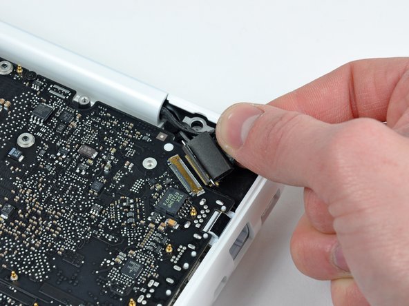 Image 2/2: The display data cable socket is made of very thin metal and is easily bent. Be sure to pull the connector straight away from its socket.
