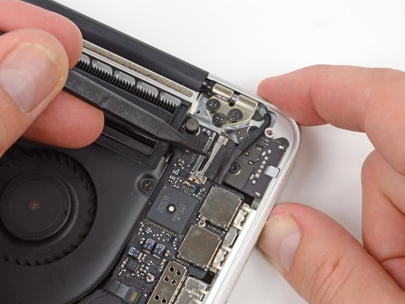 Image 2/3: Do not lift up on the display data cable, as its socket is very fragile. Pull the cable parallel to the face of the logic board.