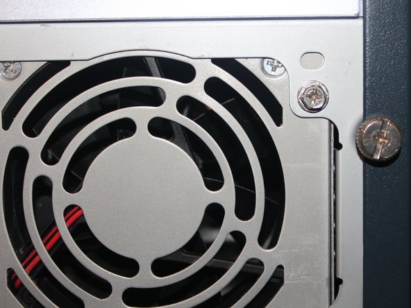 Image 1/3: When the computer is off, remove the side panel from the computer by undoing the two thumb screws and remove the cover.