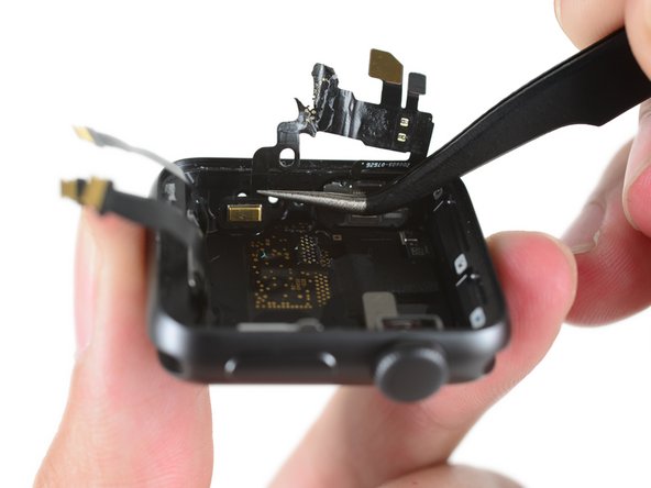 Image 1/3: And in between the two, the mystery of the second microphone port is solved. A flexible rubber plug looks like a barometric vent, designed to allow outside pressure to be felt by the internal barometer through the waterproof shell.