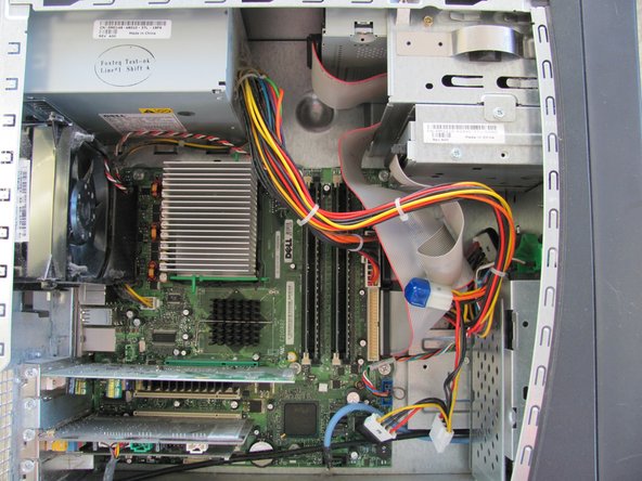 Image 1/1: Lay the computer flat on its side so that you are looking down on all of the components.