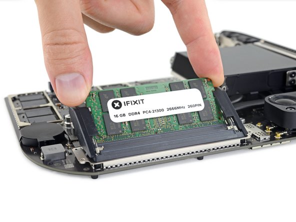 Make sure the module is oriented correctly and the notch on the bottom is aligned, and then slide it in at about the same angle as you took it out. Press evenly until the gold contacts are no longer visible.
