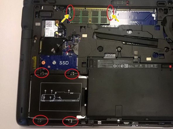 Image 1/1: The RAM's spring-loaded arms just need to be pushed away from the RAM module, and the module will then pop up and can be slid out.