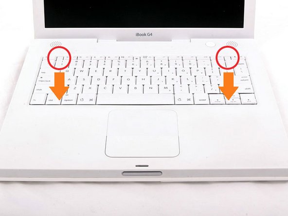 Image 1/1: If the keyboard does not come free, use a small flathead screwdriver to turn the keyboard locking screw 180 degrees in either direction and try again.