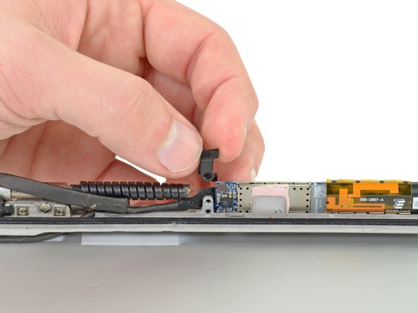 Image 2/2: Lift and remove the plastic tab up off the inverter board.