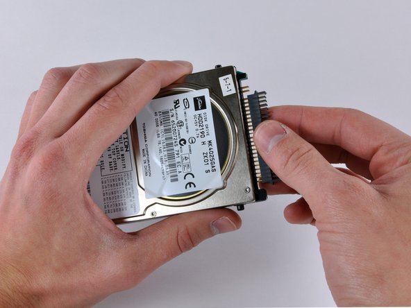 Image 1/1: This is a bit tricky. Try rocking the connector gently while pulling with even pressure. If you bend the pins, do your best to straighten them, using the hard drive connector as a guide.