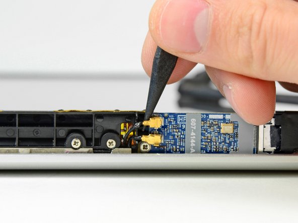 Image 2/2: Be careful not to break the sockets off the AirPort board.