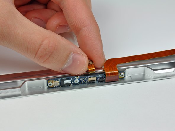 Image 3/3: Pull the camera cable out of its socket.