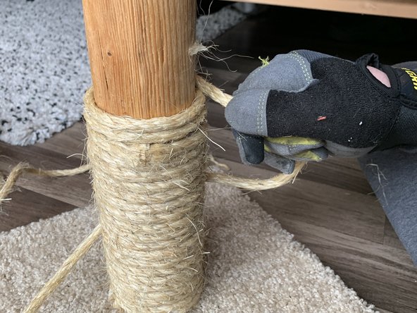 Begin wrapping the new rope around the post.