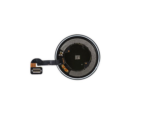 Image 2/3: With the sensor assembly removed, we spy what we assume is the inductive charging coil left behind in the cover.