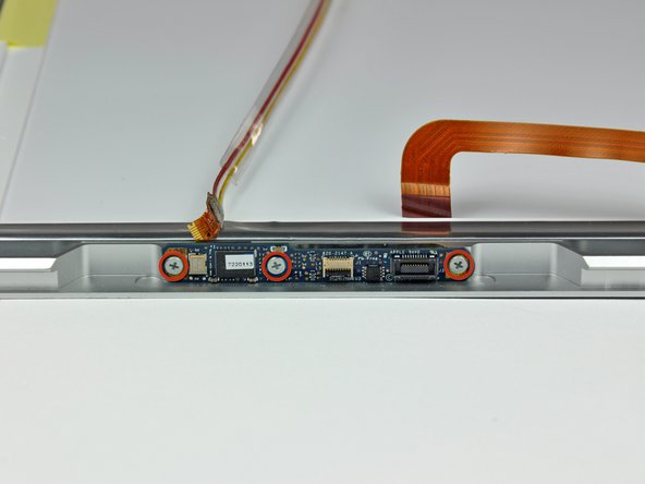 Image 1/2: Remove the camera board from the front display bezel.