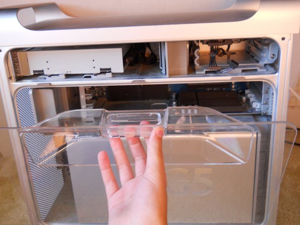 Image 2/3: pull the plastic guard toward you, and remove using the same method as before