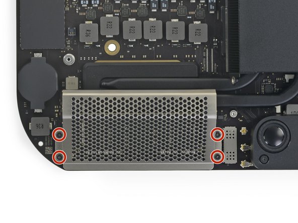 Use a T5 Torx driver to remove the four 2.8 mm screws securing the RAM shield.