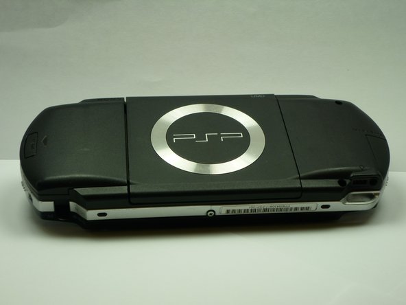 Turn the PSP over so its back is facing you.