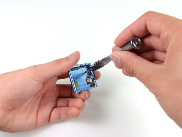 Some more screws come out and the clip is removed from the outer case.