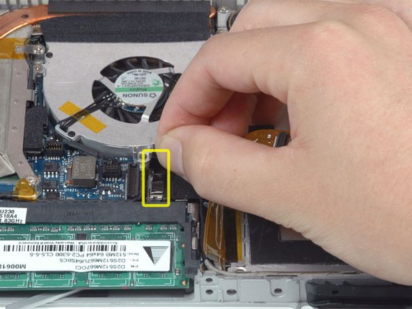 Disconnect the newly-revealed display data cable. If there is no pull-tab on the top of the connector, it may be helpful to use a spudger to disconnect this connector.