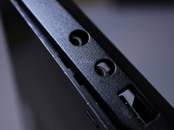 Slowly start making your way around the edge of the keyboard, prying the two pieces apart.