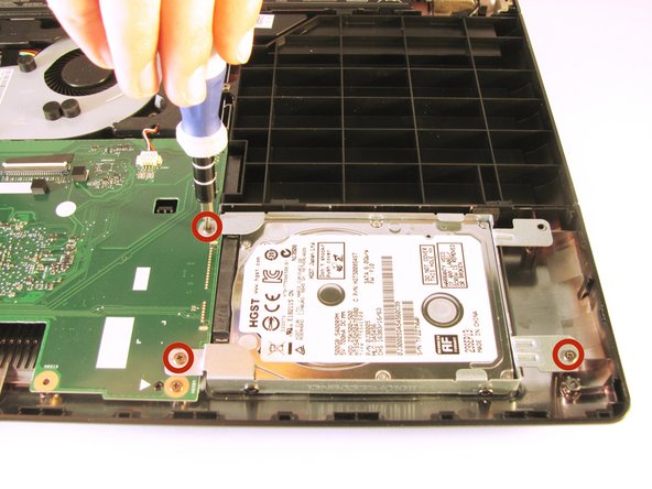 Unscrew the three 5.5 mm Phillips #0 screws with the Phillips #0 Screwdriver.