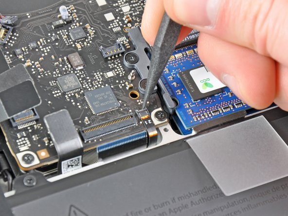 Image 2/3: Pull the keyboard backlight ribbon cable out of its socket.