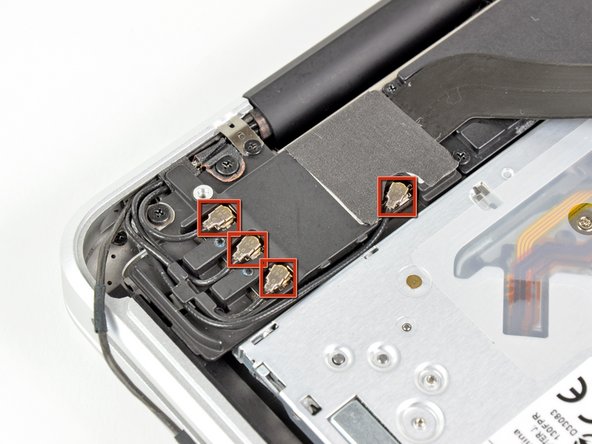 Image 1/3: To do so, use the tip of a spudger to pry their connectors up from the sockets on the AirPort/Bluetooth board.