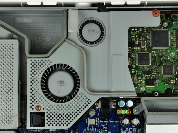 Image 1/2: The shouldered screw belongs in the lower left corner of the fan cover.