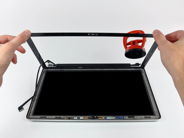 Image 2/2: Before reassembling, be sure to clean both the inside of the glass display panel and the LCD as any dust or fingerprints trapped inside will be annoyingly visible when the machine is on.