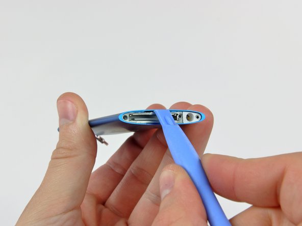 Image 1/2: The dock bezel is very thin cast aluminum. To avoid breaking it, do not excessively flex it during removal.