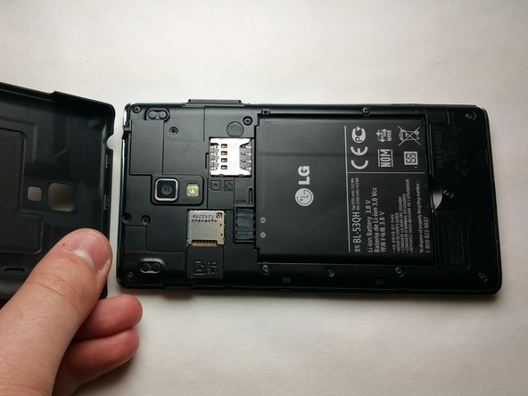 Power off the device and gently lift the battery cover off to access the battery