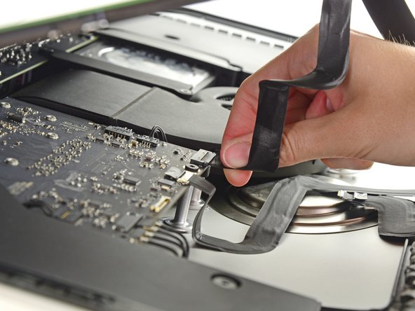 Image 1/2: Lift the display up enough to have easy access to the connector, but not so much that you stretch the cables and stress their connections (about 8").