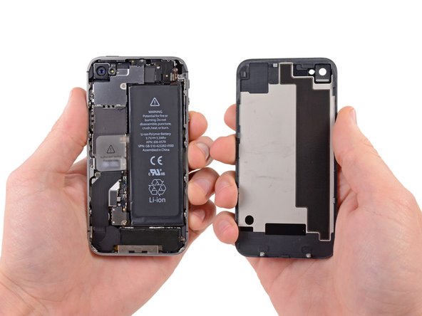 Pull the rear panel away from the back of the iPhone, being careful ...