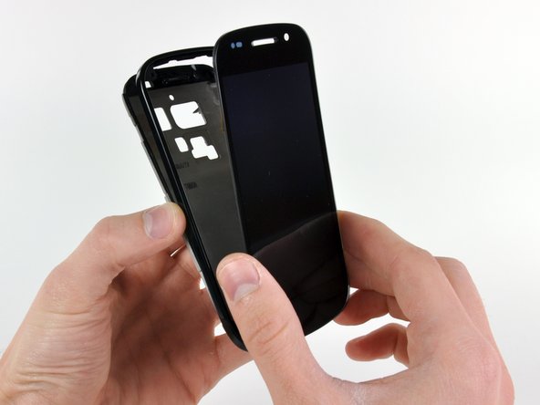 Removing the display presented us with the first stumbling block in our disassembly. A heat gun made quick work of the front case assembly, though.