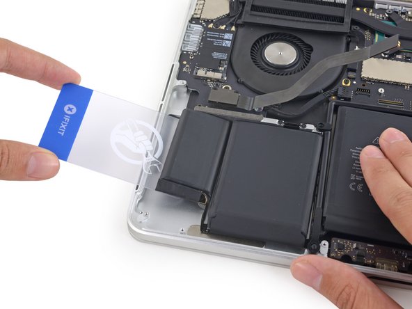 Remember to apply a small amount of adhesive remover to each battery cell, and wait 2-3 minutes for it to penetrate and soften the adhesive.