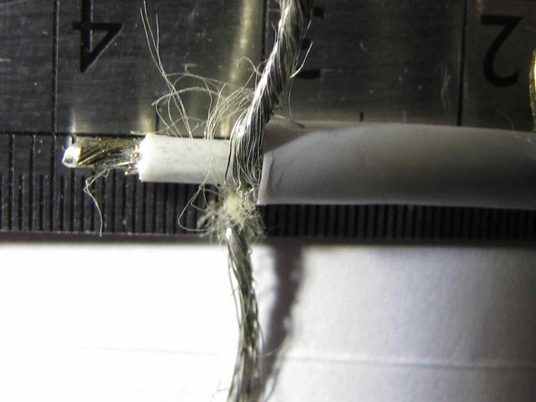 Image 1/1: Tease out the fibres that are contained within the braid and then cut them off as close to the cable as possible.