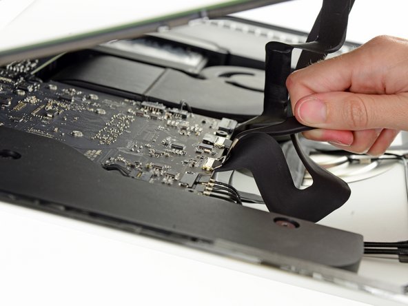 Image 2/3: Be sure to pull the display data cable connector straight out of its socket.