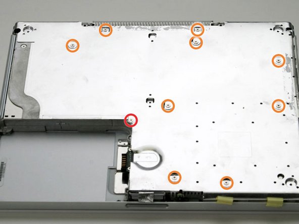 Image 1/1: One 5 mm Phillips at the upper, right corner of the battery compartment.