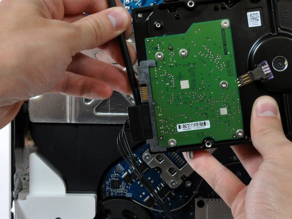 Image 2/2: Disconnect both SATA connectors.