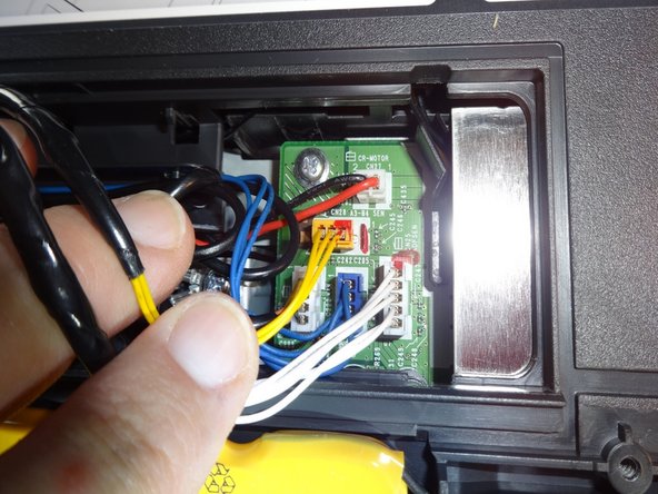 After dissconecting the connectors remove the hole top of the printer and place it safely out of the way