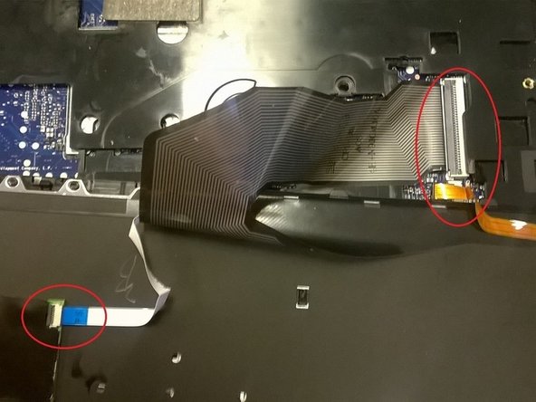 Image 1/1: Ribbon cables are held onto their connectors by a small plastic locking latch. Those latches lift up, and the cable slides out.