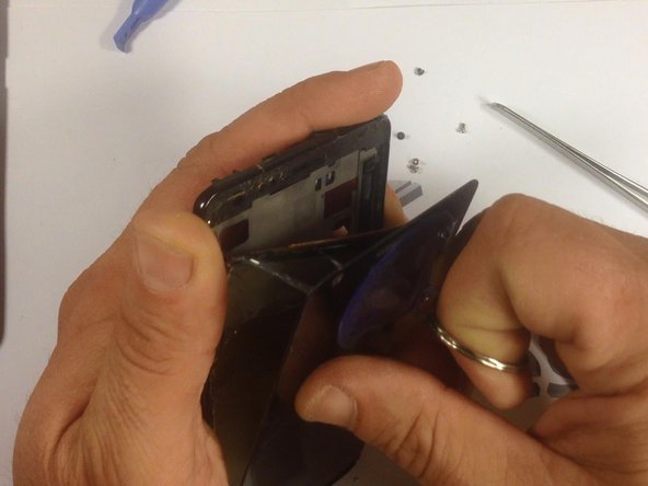 Now, use a suction tool to remove the screen from it's housing. Be careful when doing this, to prevent possible injury.