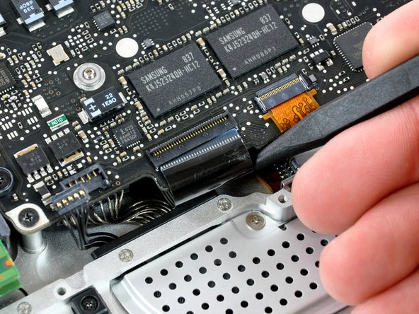 Image 2/2: During reassembly, make sure to fully insert the keyboard ribbon cable back into the ZIF socket.