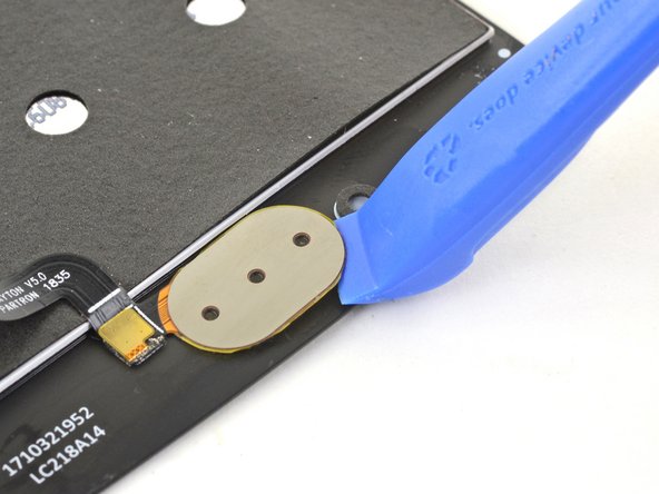 Use an opening tool to pry up and loosen the fingerprint sensor from the screen.