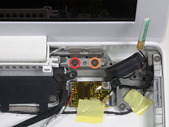 Image 1/2: One 6 mm Phillips on the left side of the hinge mount.