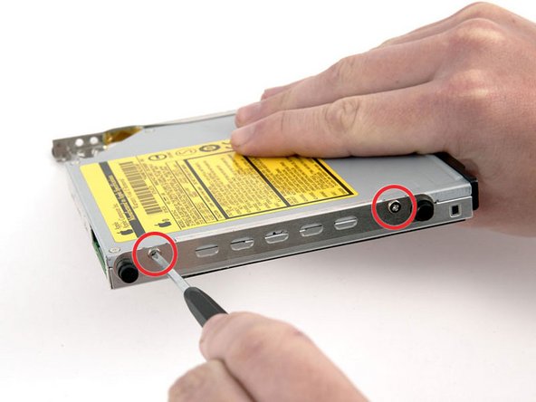 Image 1/1: Remove the 2 Phillips screws from the side with the longer bumper.