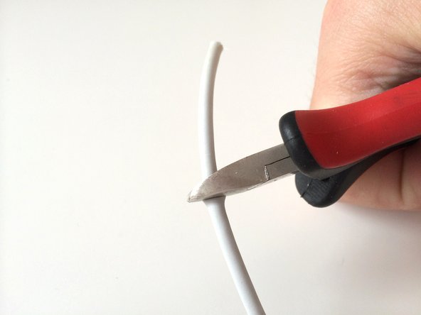 Image 1/1: Cut the main wire at a few centimetres away from where the tear occurred. This'll ensure you won't be reusing any damaged piece of the wire.