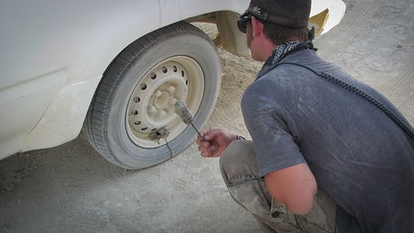 Car repair while driving in the desert