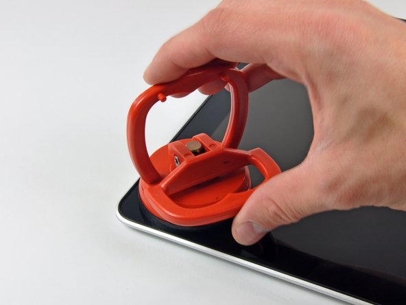 Image 1/3: Don't fasten the suction cup on top of the rubber strip around the edge of the display glass.