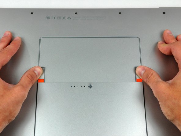 Image 1/2: The battery should pop up enough to rotate it toward yourself and lift it out of the lower case.