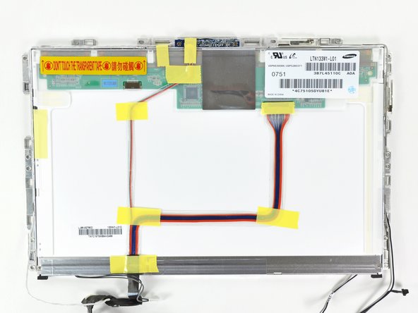 Turn the LCD panel assembly over so that the screen is face down. You may want to use a cloth on your worksurface to prevent scratching the screen.