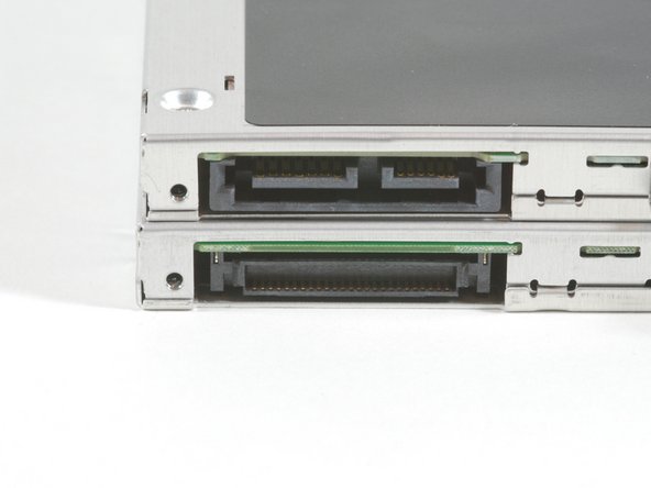 Image 2/3: You can see the different connectors in the middle picture. The new, SATA connector is on top.