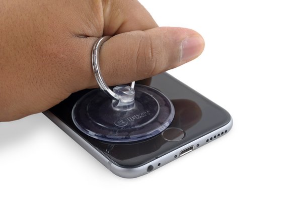 Pull up on the suction cup with firm, constant pressure to create a slight gap between the front panel and rear case.